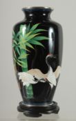 A JAPANESE BLACK GROUND CLOISONNE VASE, with cranes and bamboo, the foot rim marked 'Japan', '