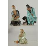 THREE CHINESE SHIWAN GLAZED POTTERY FIGURES, (two with loss), various sizes, (3).