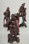 THREE CHINESE CARVED WOOD FIGURES, (3).