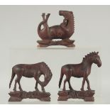 THREE CHINESE CARVED WOODEN HORSES, with inset eyes, (3).