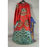 A CHINESE SILK ROBE, with gilt-threaded embroidered dragons.