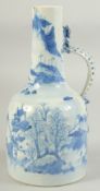 A JAPANESE ARITA BLUE AND WHITE PORCELAIN JUG, painted with landscape and with dragon formed handle,