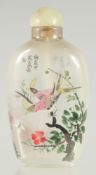 A CHINESE REVERSE GLASS PAINTED SNUFF BOTTLE AND JADE STOPPER, 8.5cm high.
