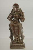 A 17TH CENTURY SOUTH INDIAN BRONZE HINDU DEITY, 9cm high.