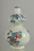 A CHINESE DOUCAI PORCELAIN DOUBLE GOURD VASE, painted with various fruits, 20.5cm high.
