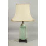 A CHINESE CELADON GLAZE SQUARE FORM VASE LAMP, mounted to a hardwood base, the vase with relief
