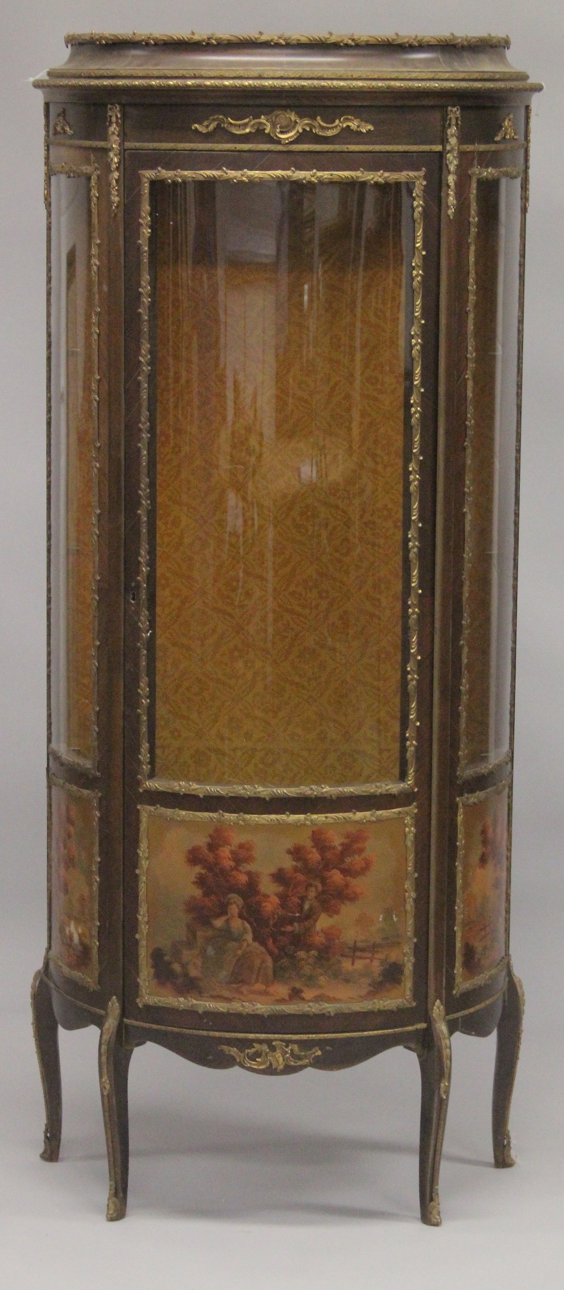 A VERNIS MARTIN VITRINE with three quarter panel doors on curving legs. 5ft 9ins high, 2ft 4ins