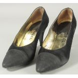 A PAIR OF CHANEL BLACK FABRIC SHOES in a Chanel box. Size 37.5.