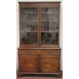A LARGE GEORGIAN MAHOGANY STANDING BOOKCASE the top with double panel glazed doors, the base with