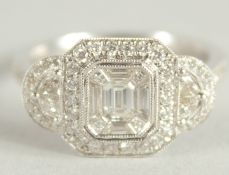 AN 18 CARAT WHITE GOLD AND DIAMOND RING. (Total diamond weight approx. 1.2 carat)