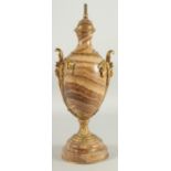 A GOOD 19TH CENTURY FELSPAR URN with ormolu mounts, on a circular base. 17ins high.