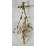 AN ORNATE CLASSICAL REVIVAL GILT BRONZE AND BLACK JAPANNED CHANDELIER, with ribbon decoration
