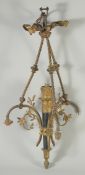 AN ORNATE CLASSICAL REVIVAL GILT BRONZE AND BLACK JAPANNED CHANDELIER, with ribbon decoration