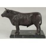 A BRONZE BULL on a marble base. 9ins long.