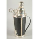 A SILVER PLATED AND LEATHER GOLF BAG COCKTAIL SHAKER and fittings. 12ins high.