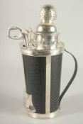 A SILVER PLATED AND LEATHER GOLF BAG COCKTAIL SHAKER and fittings. 12ins high.