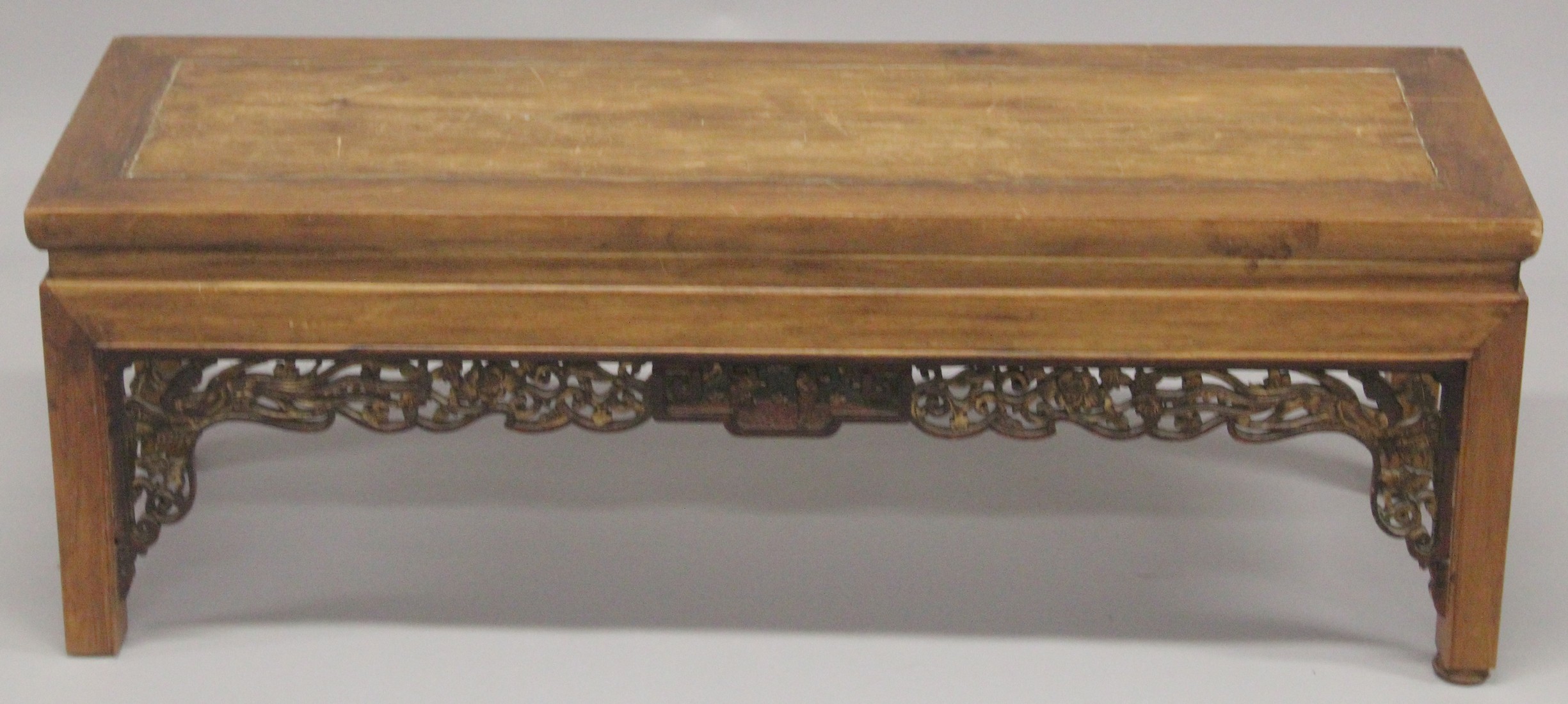 A CHINESE REDWOOD OPIUM TABLE 4ft long, 1ft4ins high.