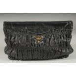 A PRADA SOFT BLACK LEATHER HAND BAG. 11ins long, 8ins high. with dust bag.