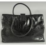 A LARGE JAEGER BLACK LEATHER BAG with short handles. 37cm long, 26cm high 12cm deep with Jaeger