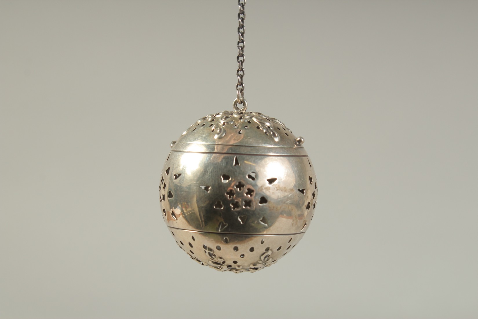 A SILVER GLOBULAR TEA INFUSER on a chain. 1.75ins diameter. - Image 2 of 4