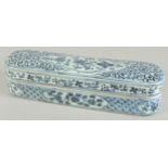A CHINESE BLUE AND WHITE PORCELAIN PEN BOX. 32cm long.