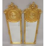 A PAIR OF LOUIS XVTH DESIGN UPRIGHT MIRRORS 5ft 10ins high, 1ft 6ins wide.