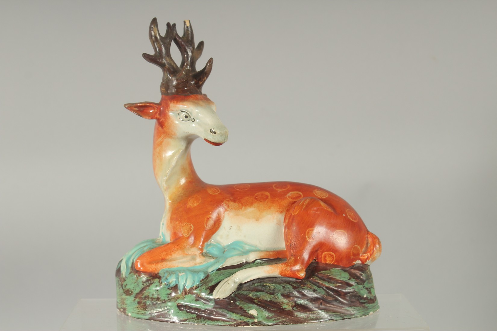 TWO LARGE STAFFORDSHIRE SEATED DEER with spots on rustic bases 7ins & 4.5ins. - Image 2 of 4