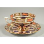 A ROYAL CROWN DERBY PEDESTAL TEA CUP AND SAUCER. Pattern no. 92929.