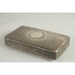 A RECTANGULAR DUTCH SILVER TOBACCO BOX. 5ins long.