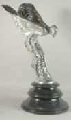 A LARGE SILVERED ROLLS ROYCE FIGURE on a circular base.