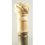 A WALKING STICK with carved bone handle, 'KNOT'.