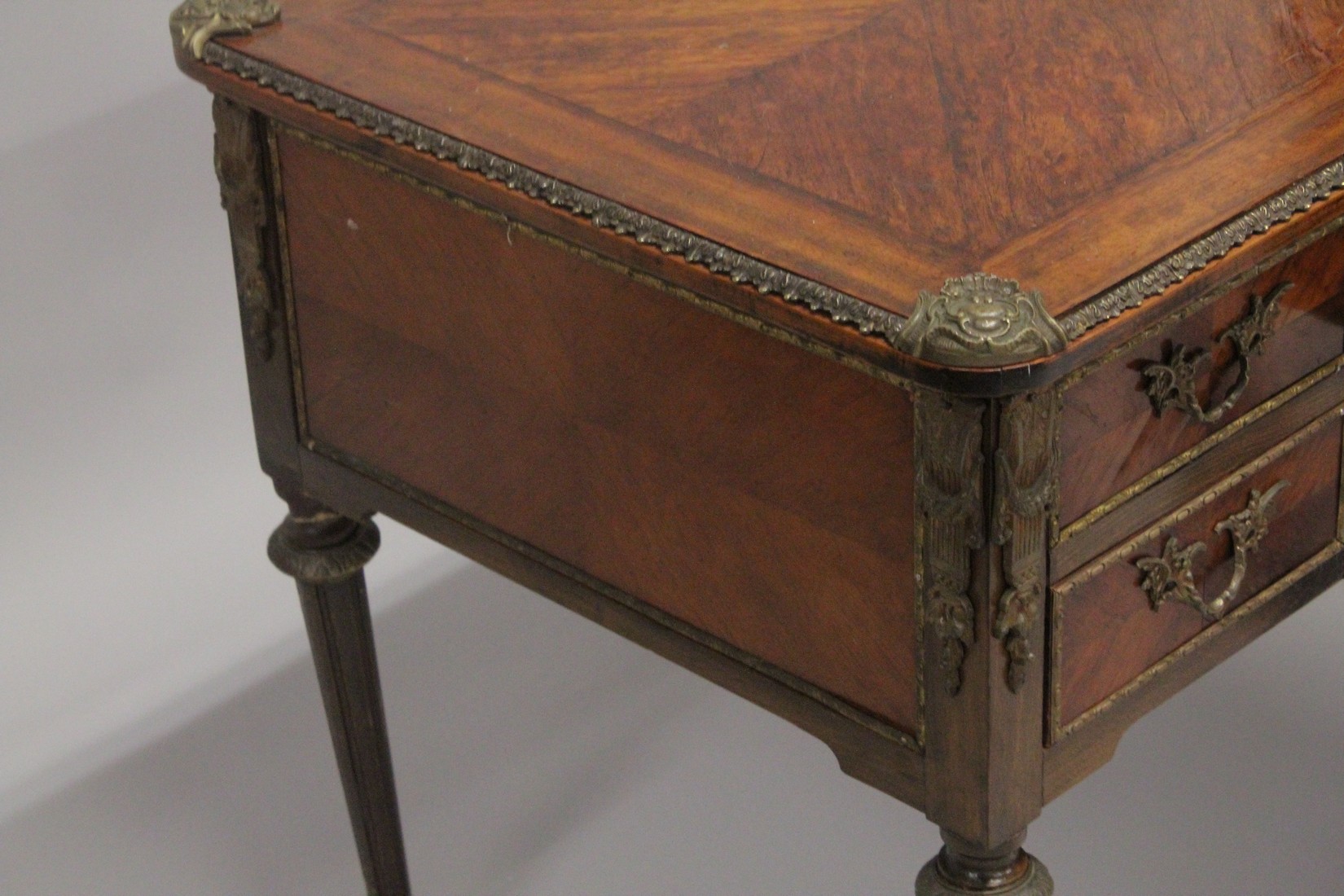 A LOUIS XVITH DESIGN WRITING TABLE with wooden top, five drawers on turned legs with ormolu - Image 5 of 7