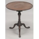 A GEORGIAN MAHOGANY CIRCULAR TRAY TOP TRIPOD TABLE with birdcage support and three pad feet. 2ft