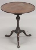 A GEORGIAN MAHOGANY CIRCULAR TRAY TOP TRIPOD TABLE with birdcage support and three pad feet. 2ft