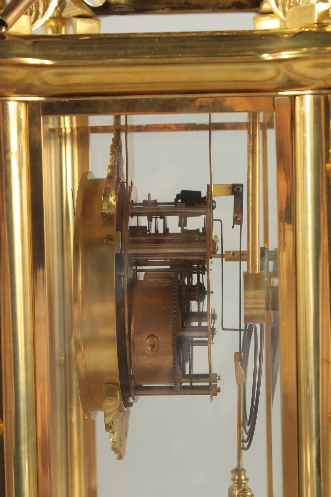 A GOOD GILT BRONZE FOUR GLASS CLOCK with pineapple finials on claw feet. 24ins high. - Image 4 of 5