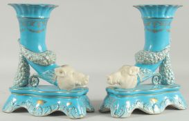 A PAIR OF SEVRES STYLE BLUE BOARS HEAD CORNUCOPIA VASES. 16ins high