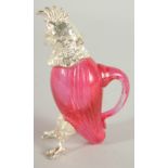 A SMALL RUBY GLASS AND SILVER PLATED COCKATOO DECANTER. 5ins high.