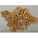 A GOOD CHANEL GILT LONG CHAIN with eleven double C's. 36ins long. Stamped, Chanel 1982.