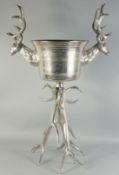 A LARGE PLATED STAG WINE COOLER ON A STAND. 3ft 6ins high.
