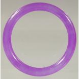 A CHINESE LAVENDER JADE BANGLE 3ins diameter.