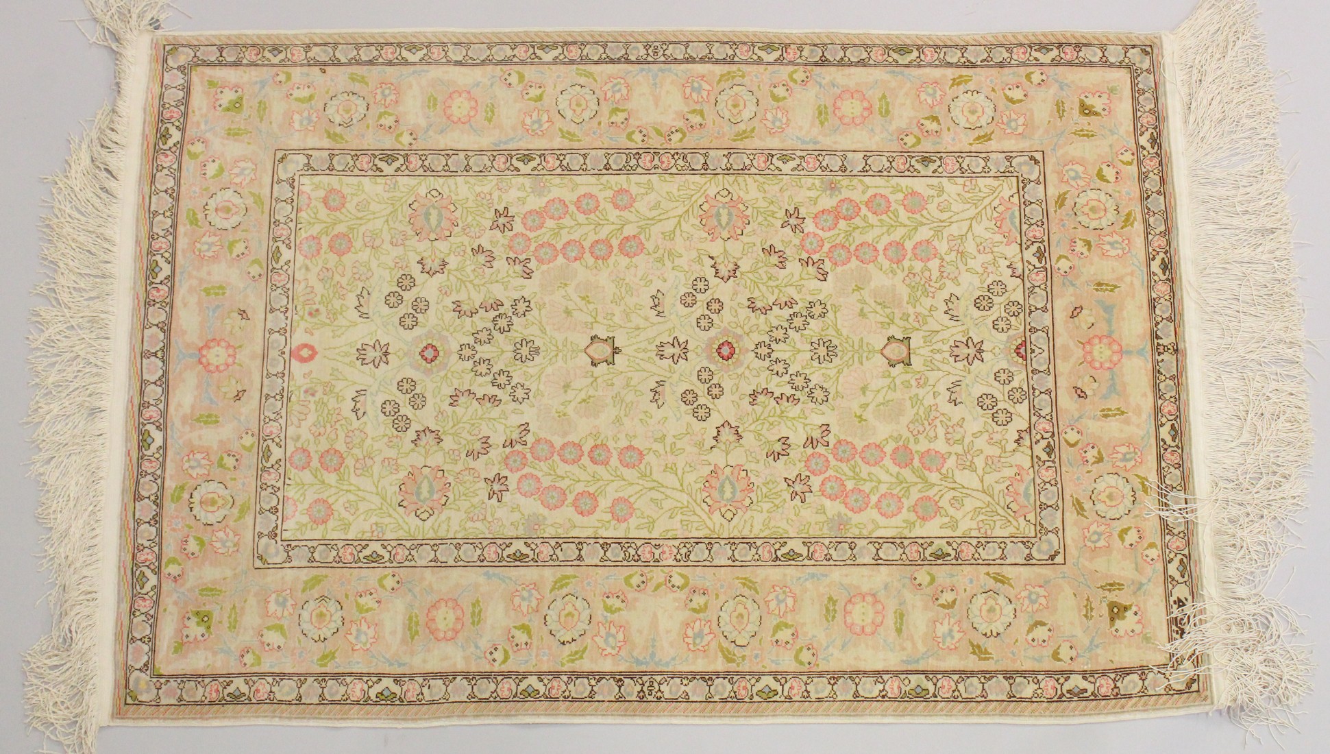 A GOOD SMALL PERSIAN SILK RUG, CREAM GROUND with stylised floral decoration, within a similar