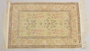 A GOOD SMALL PERSIAN SILK RUG, CREAM GROUND with stylised floral decoration, within a similar