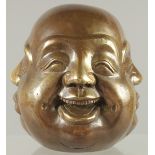 A BRASS FOUR FACES BUDDHA. 4.5ins high.