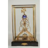 A GILT EAGLE MOONPHASE SKELETON CLOCK in a glass case. 17ins high.