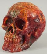 A CARVED AMBER SKULL. 5ins high.