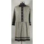 A CHANEL GREY DRESS, with black trim and bow, Chanel double C buttons. Size label removed, approx.