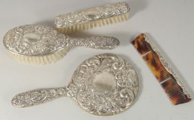 A FOUR PIECE SILVER MIRROR AND BRUSH SET.