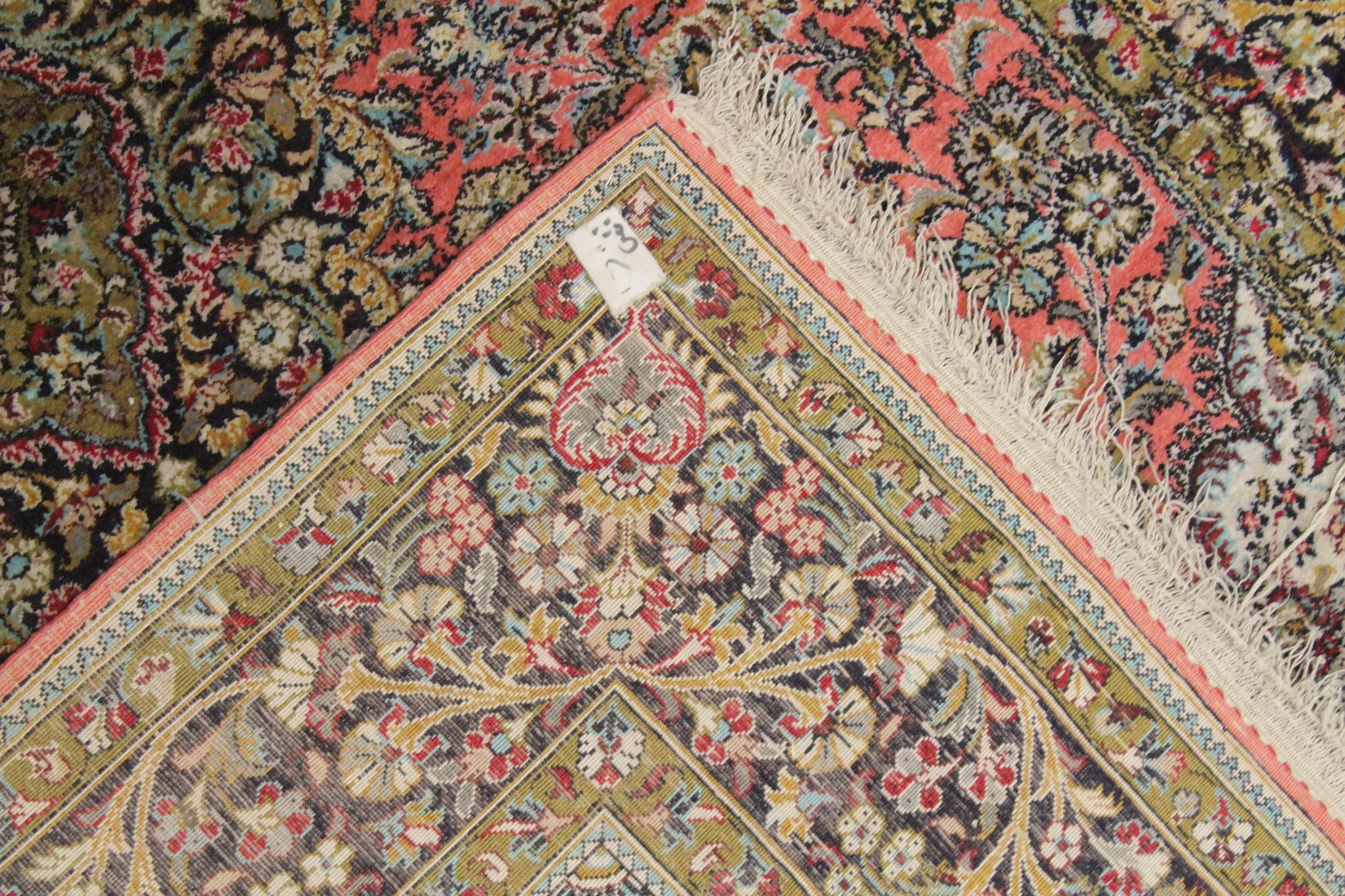 A PERSIAN PART SILK CARPET pink ground with sylised floral decoration within a similarly border. - Image 4 of 4