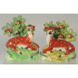 A PAIR OF STAFFORDSHIRE BOCAGE GROUP OF SHEEP AND LAMBS with Bocage backs. 6ins high.