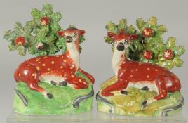 A PAIR OF STAFFORDSHIRE BOCAGE GROUP OF SHEEP AND LAMBS with Bocage backs. 6ins high.